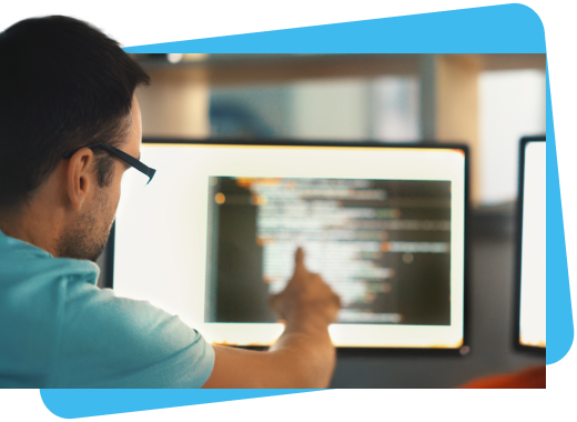 man pointing at computer screen - payment solutions
