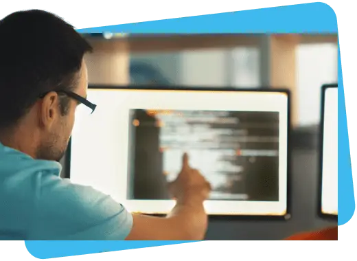man pointing at computer screen - payment solutions