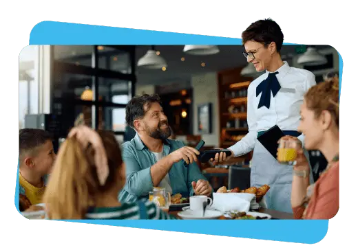 family at restaurant table with father paying by tap payment to server - hospitality payment solutions